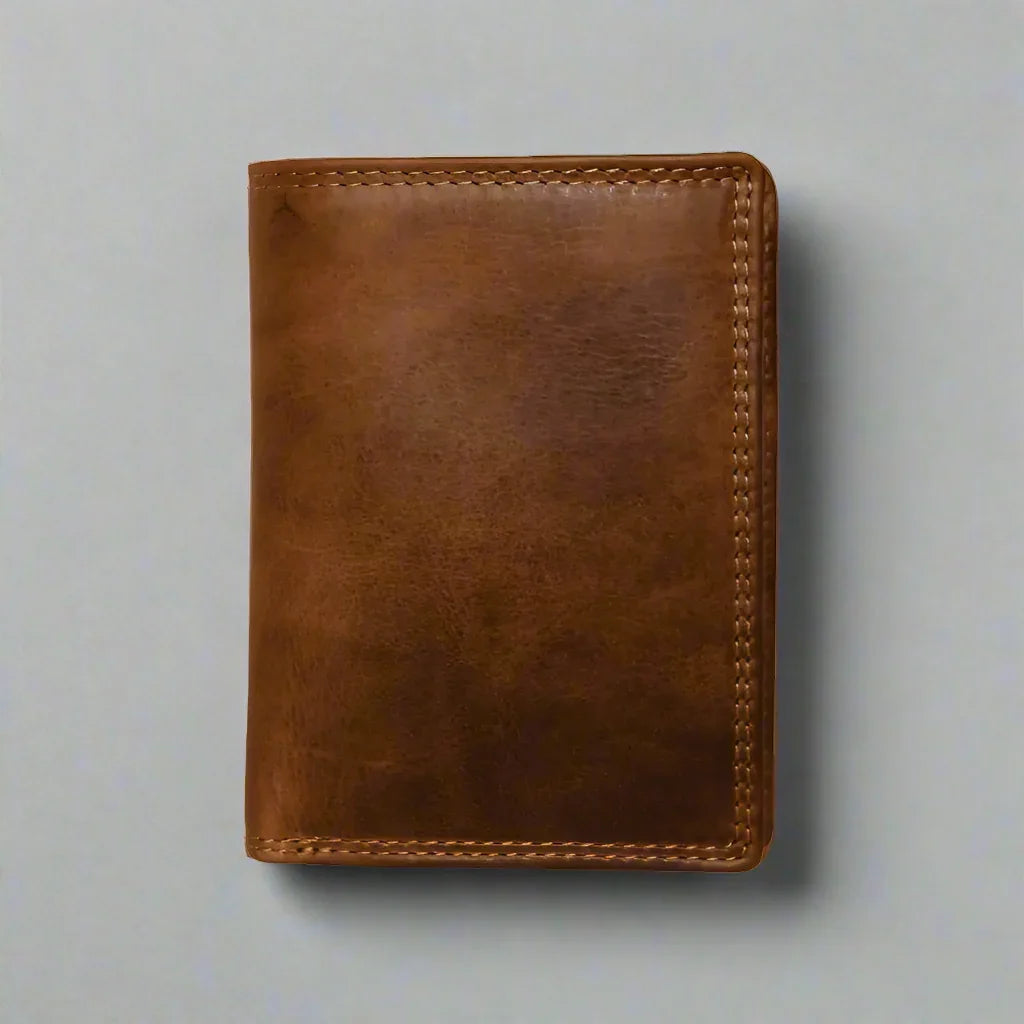 Tri-fold men's brown leather wallet with visible stitching on plain background