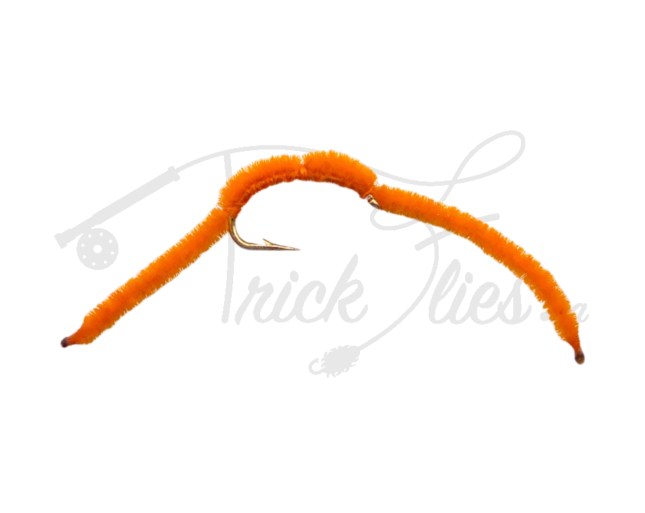 San Juan Worm orange fly fishing lure with curved hook on a white background