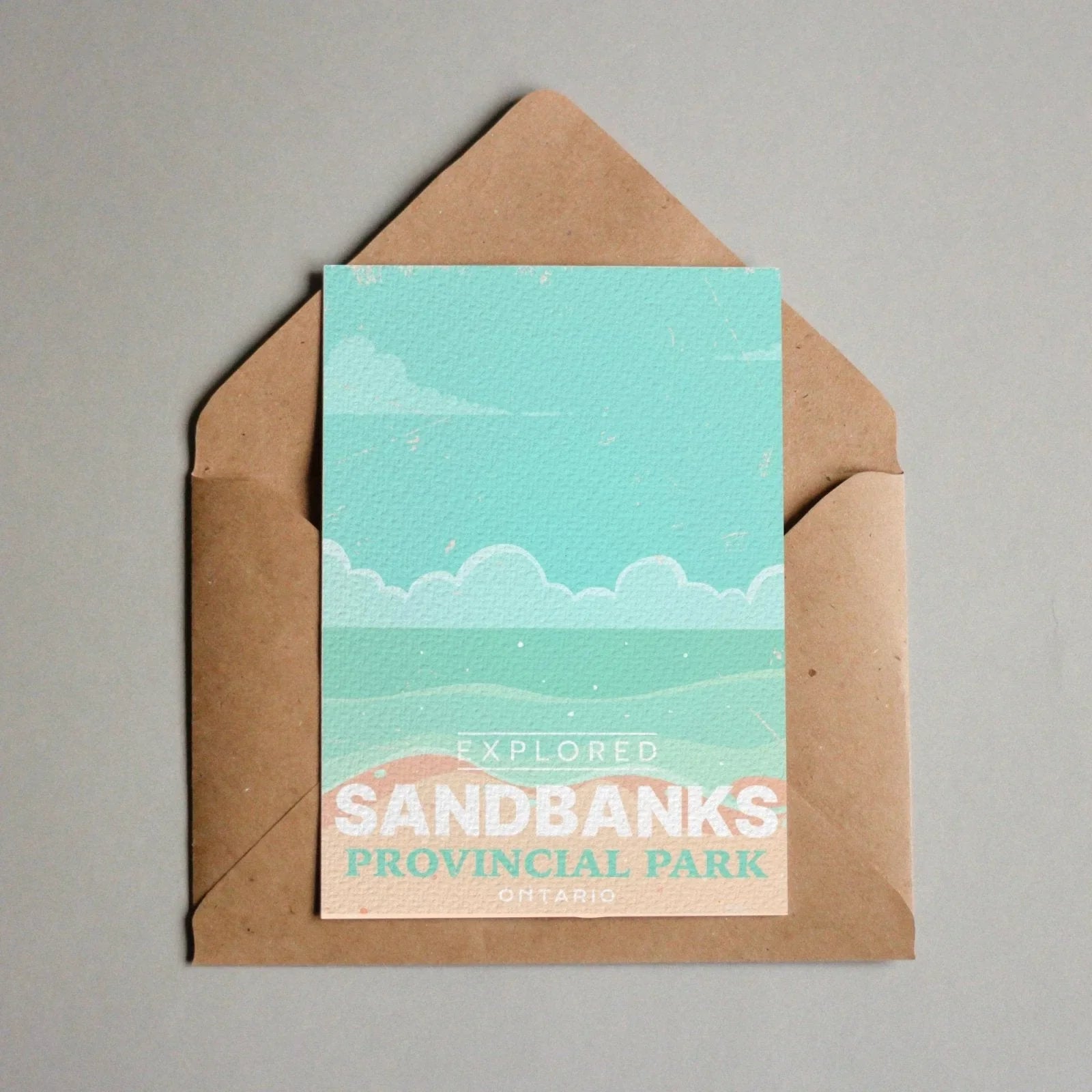 Sandbanks Provincial Park Ontario postcard in brown envelope on gray background