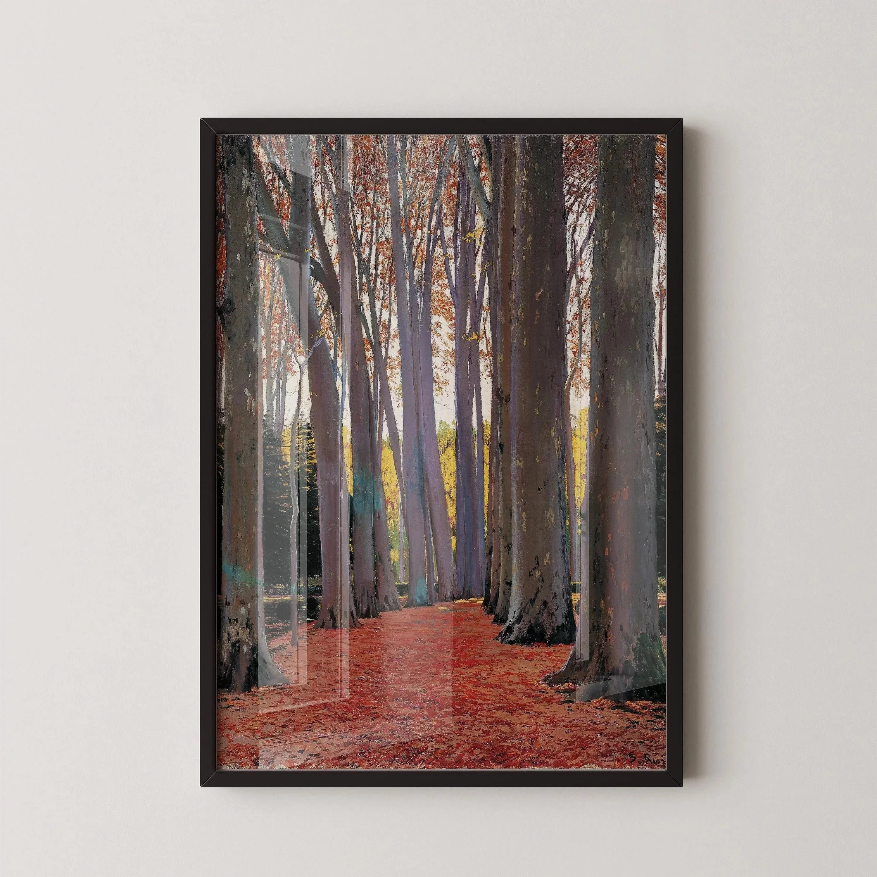 Framed print of tall plane trees lining a red-leafed path, classic Spanish artwork on wall
