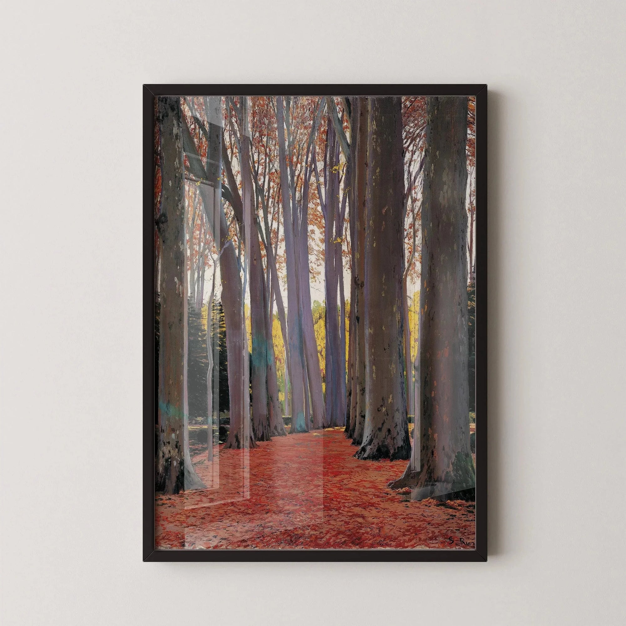 Framed print of tall plane trees lining a red-leafed path, classic Spanish artwork on wall