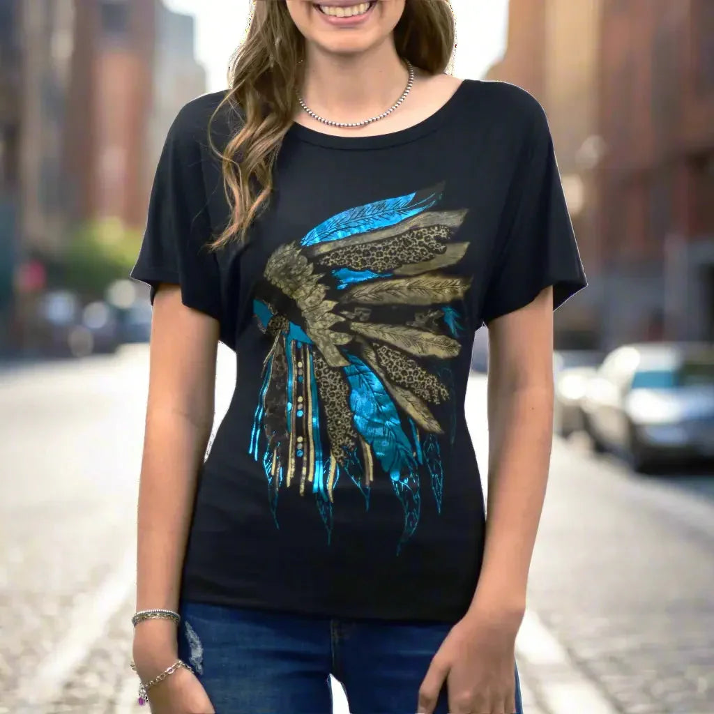 Woman wearing scoop neck tee with blue rhinestone headdress design, casual street style