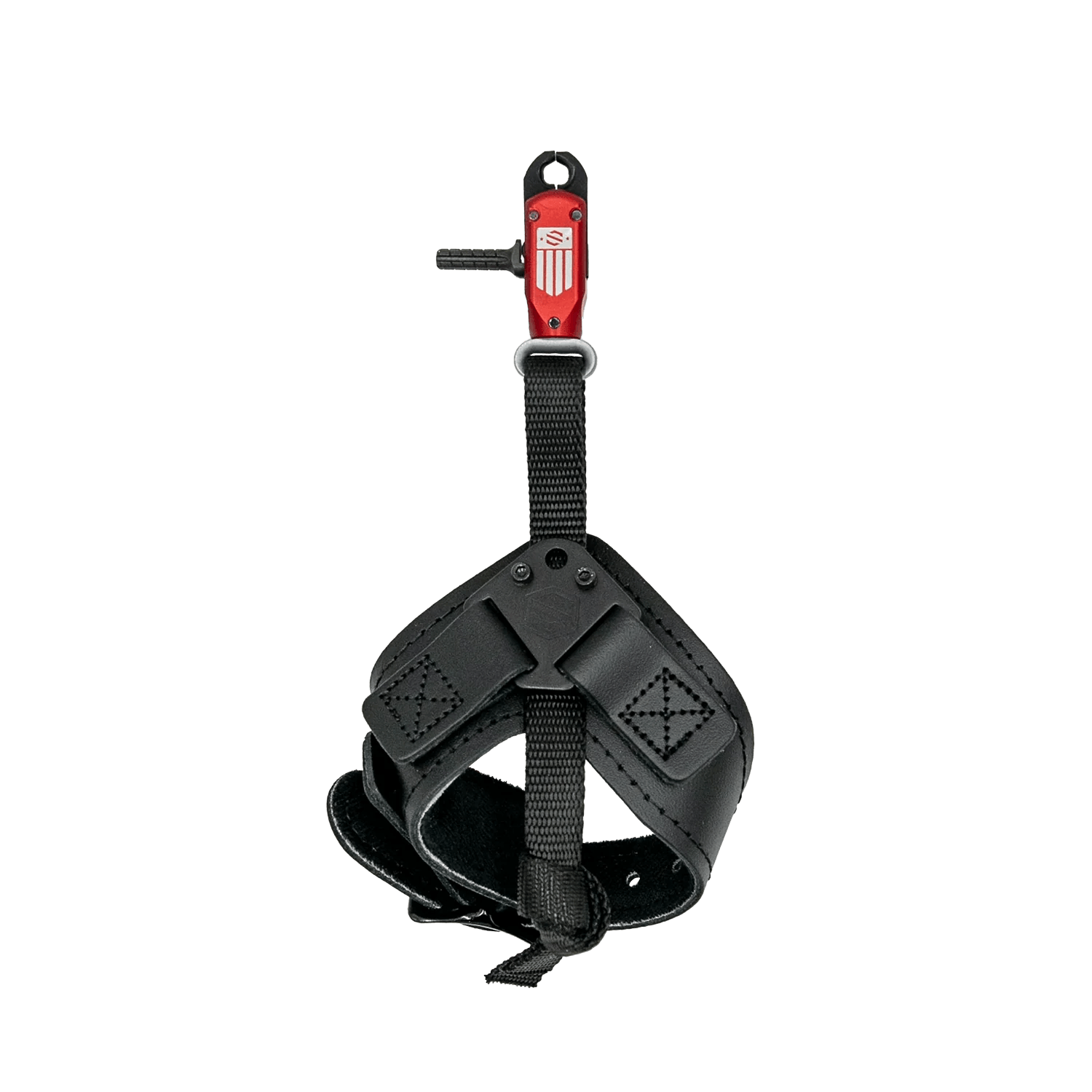 Archery wrist release aid with black leather strap and red metal trigger on gray background.