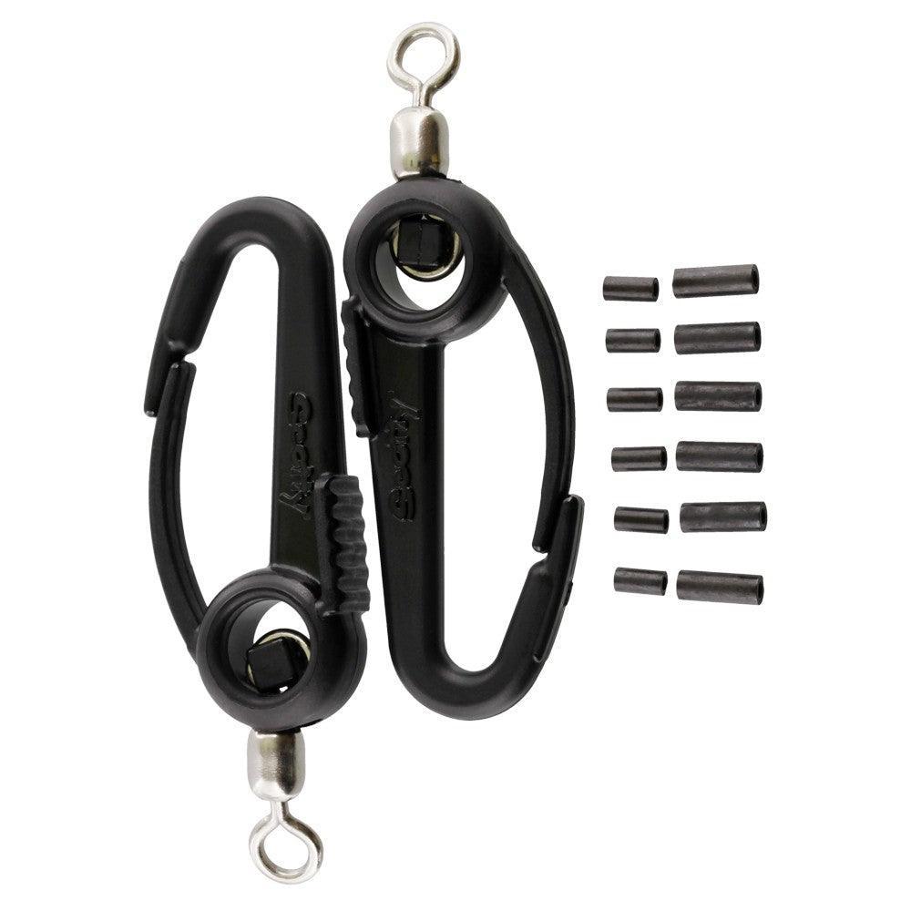 Black plastic fishing line clips and sleeves set on white background, fishing accessories