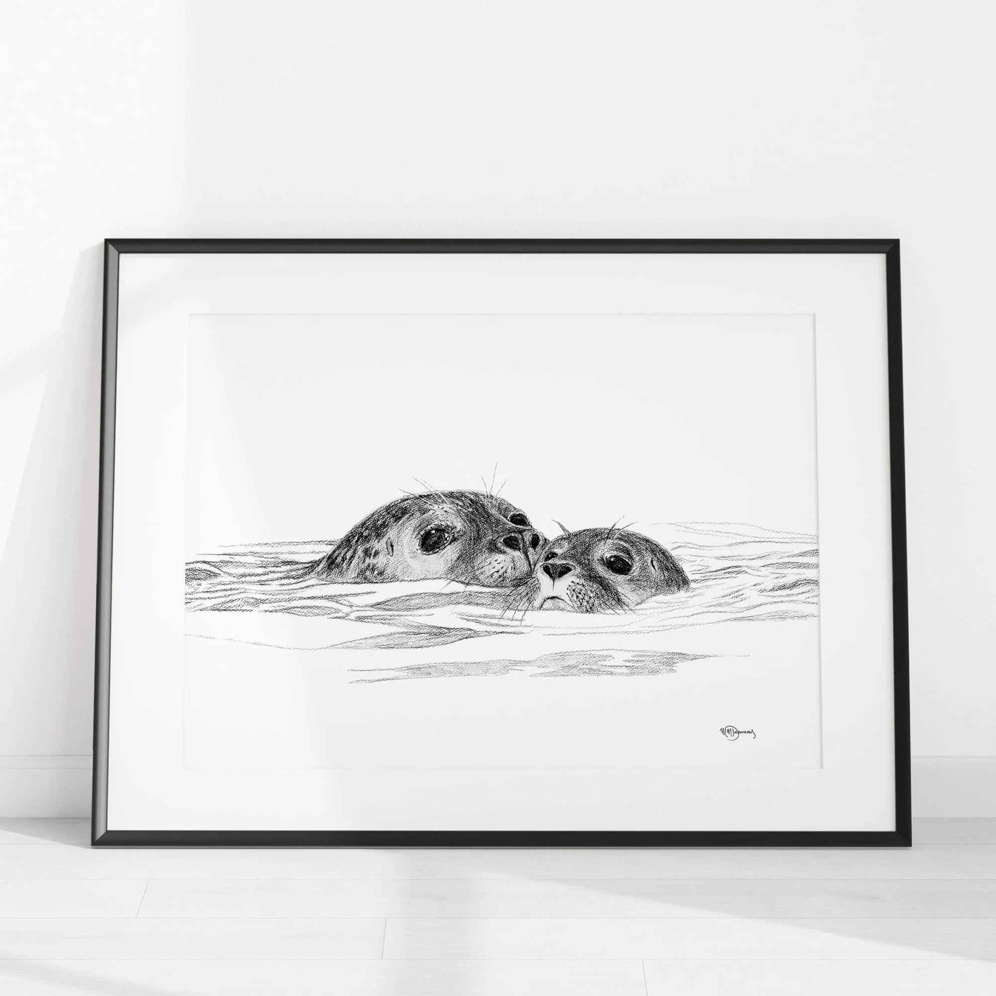Black and white illustration of a seal and cub swimming, framed minimalist wall art