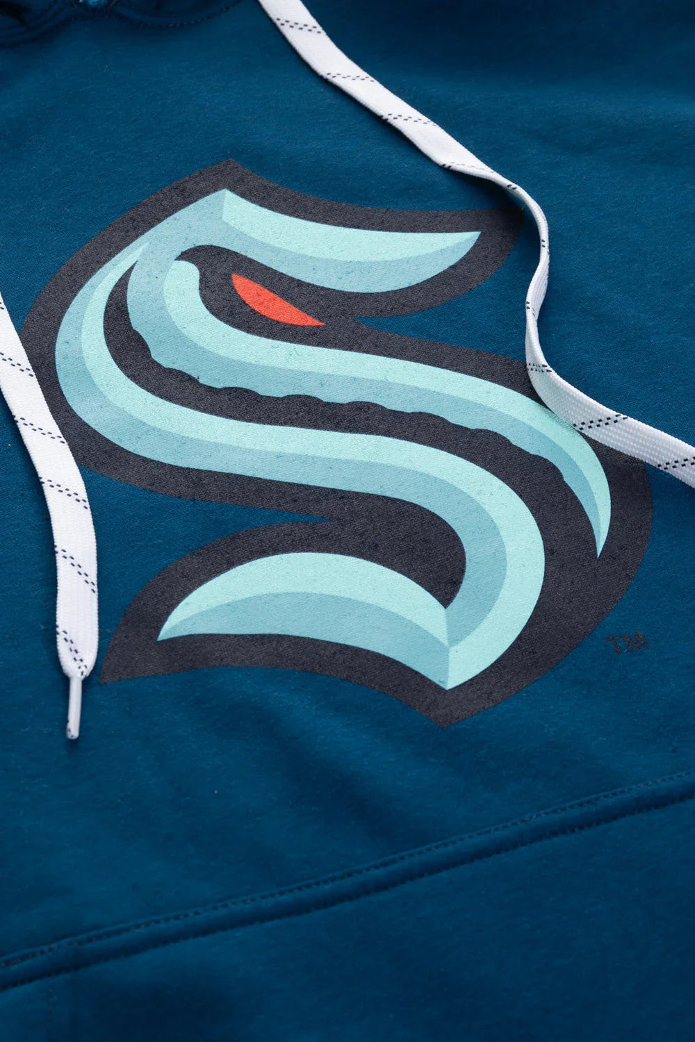Seattle Kraken varsity hoodie close-up with team logo and white drawstrings