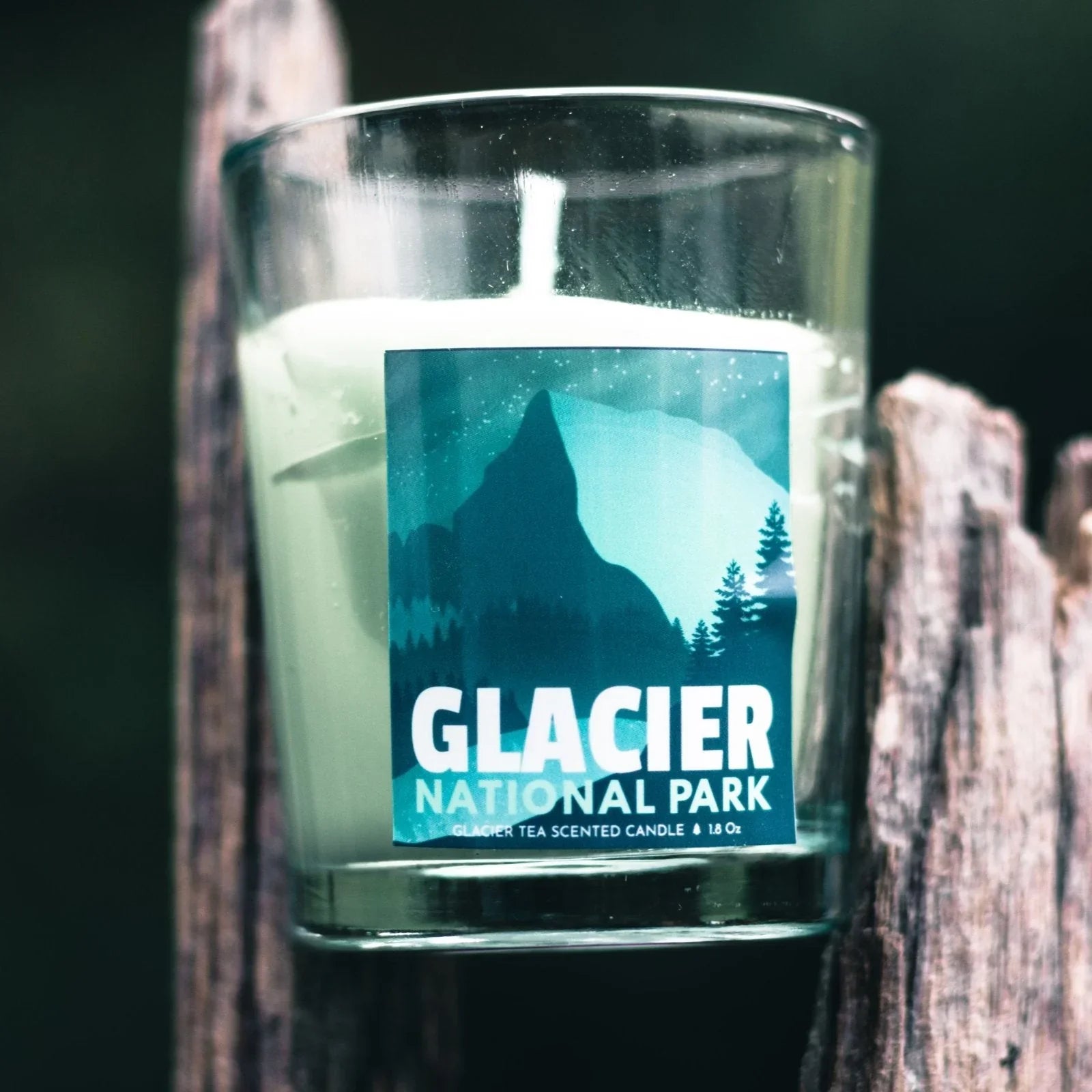 Glacier National Park scented candle in glass with mountain and forest label