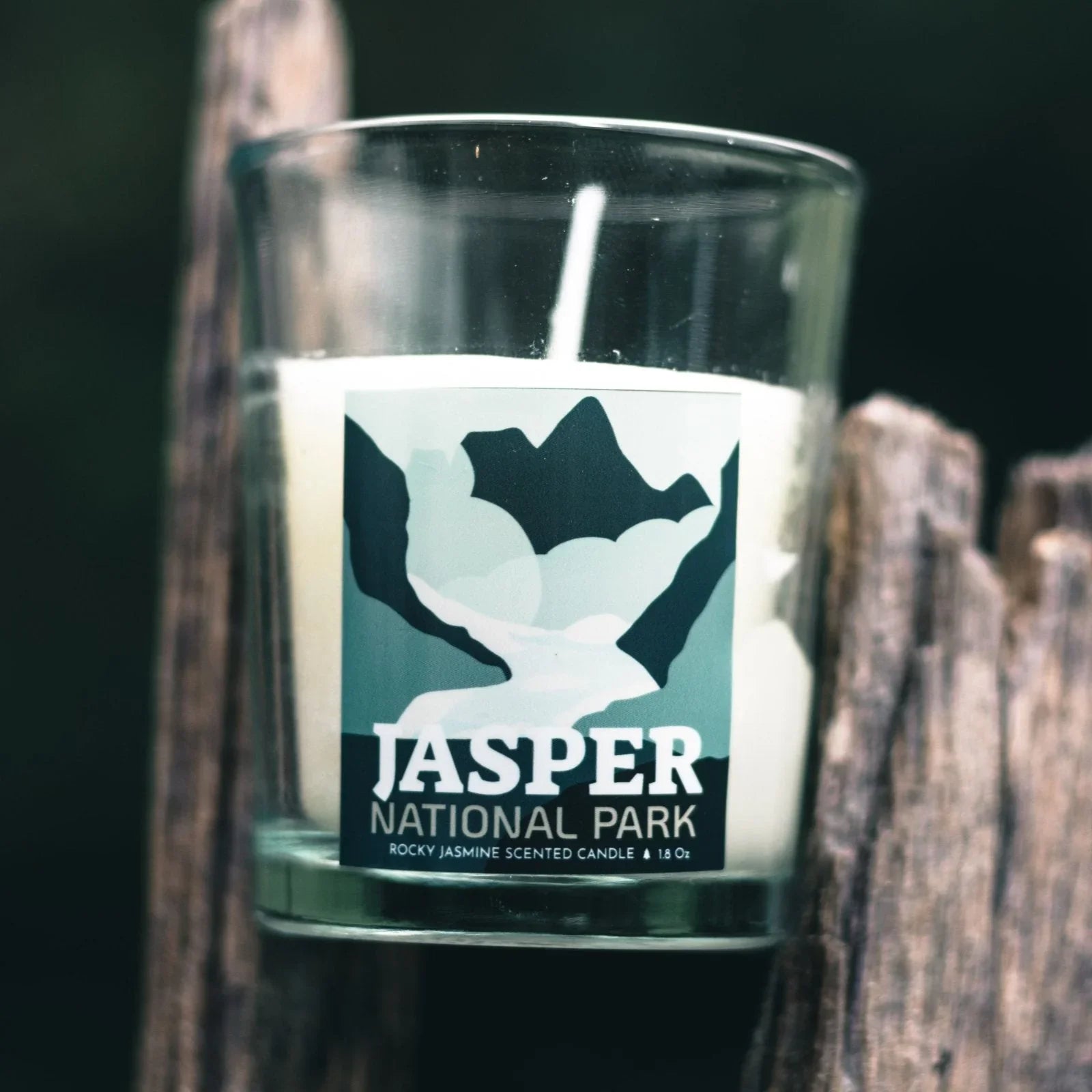 Jasper National Park scented candle in glass jar with mountain design label
