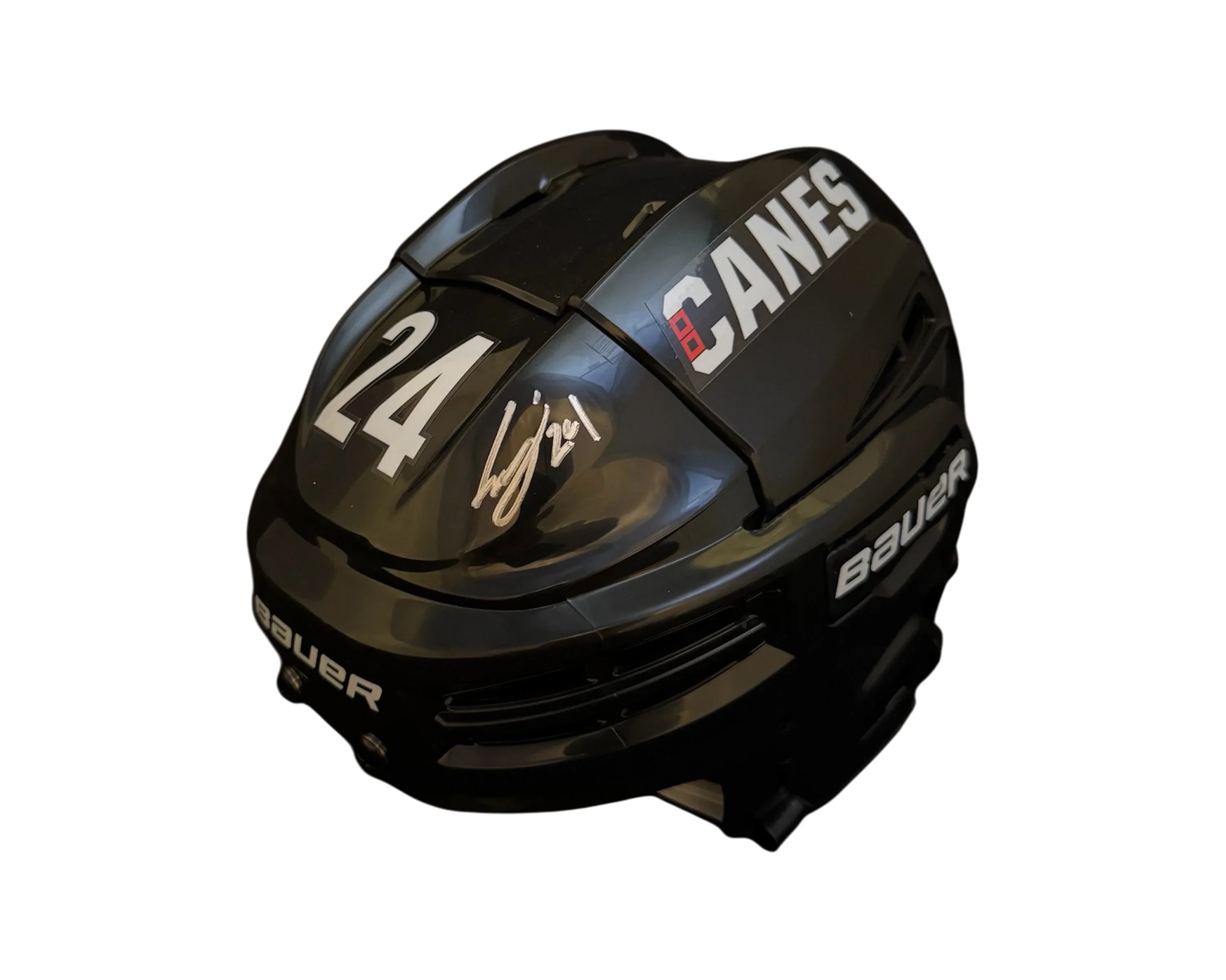 Black Bauer hockey helmet with 'CANES', number 24, and a silver autograph on top