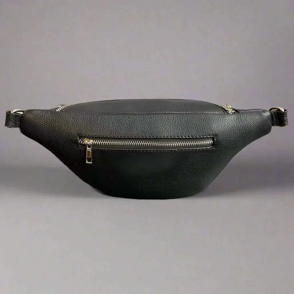 Black sheep leather waist bag with silver zipper on neutral background