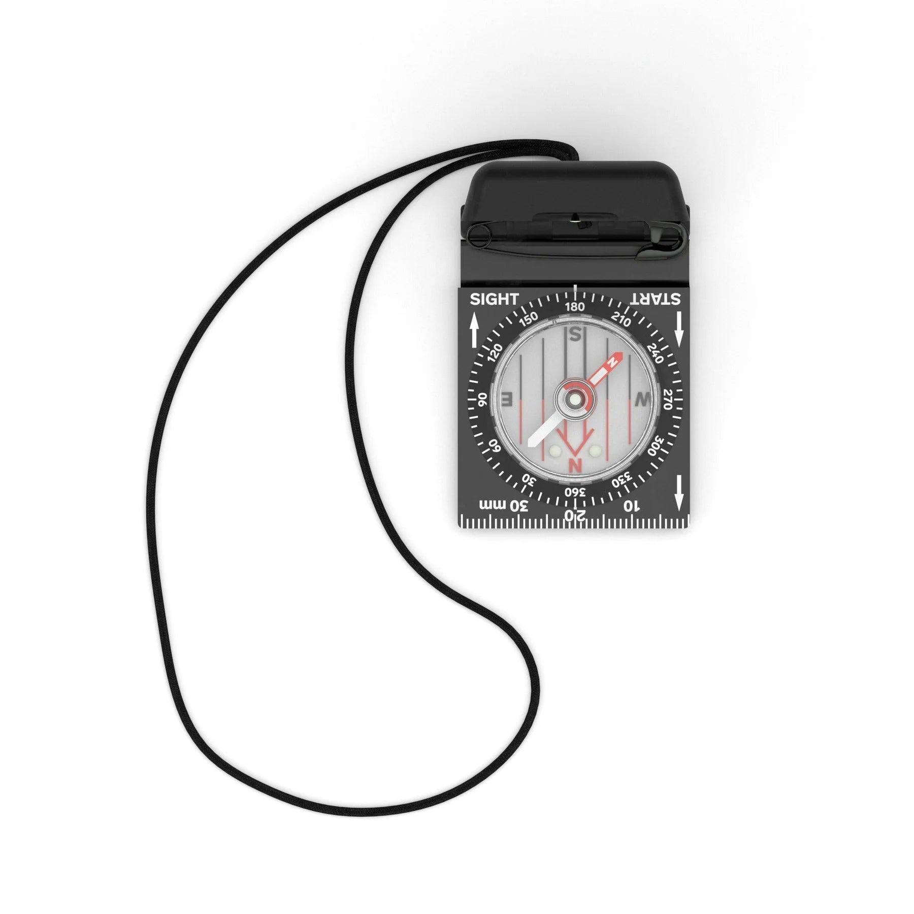 Top view of a black lensatic compass with lanyard and marked dial on white background