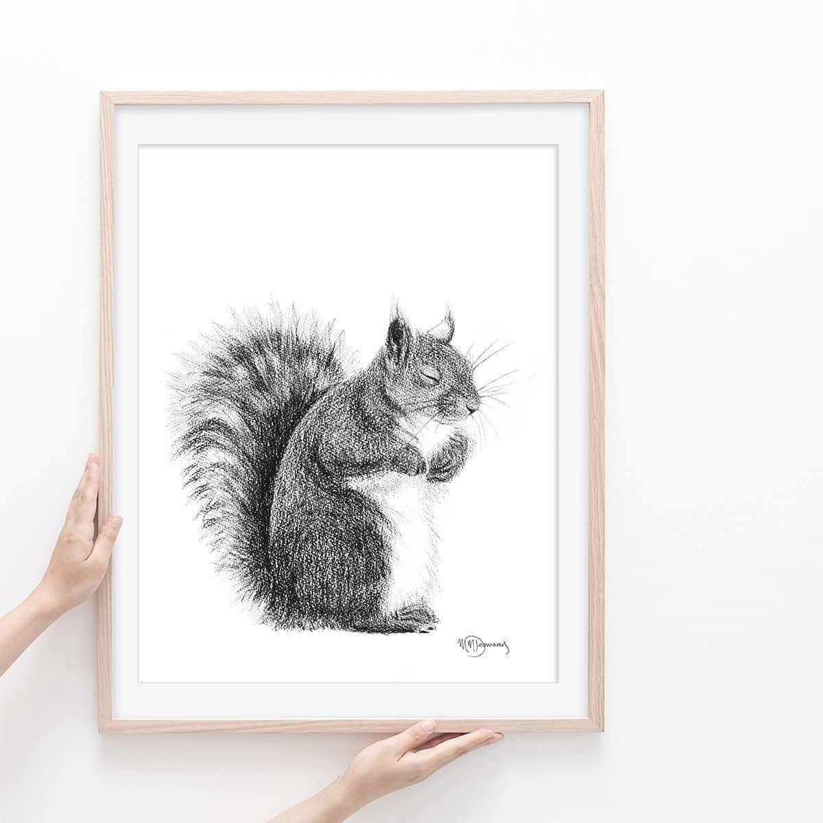 Sleeping squirrel illustration in black and white, framed art print held by hands