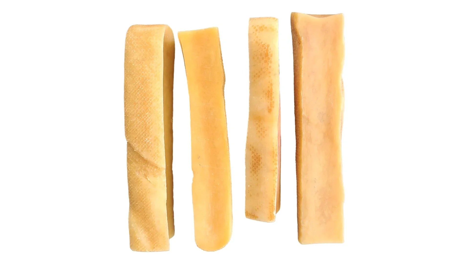 Four small Himalayan yak cheese dog chews on white background