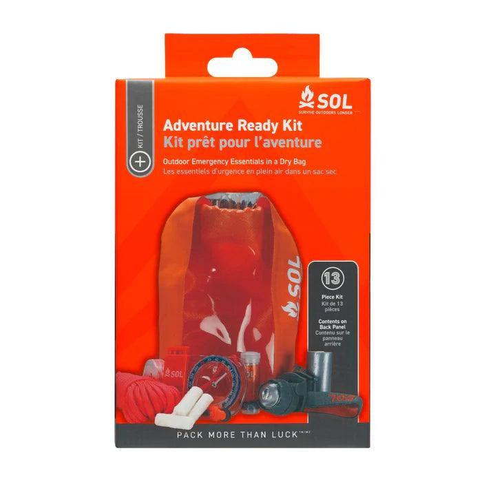 SOL Adventure Ready Survival Kit in orange packaging with dry bag and emergency gear visible.