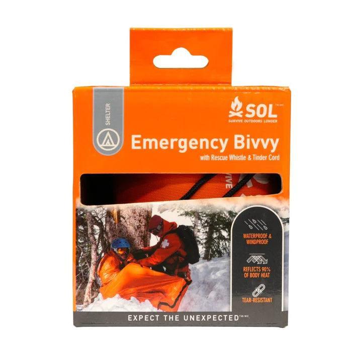 SOL Emergency Bivvy orange packaging with rescue whistle, outdoor survival gear