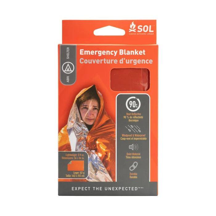 SOL emergency blanket orange packaging with woman wrapped in reflective survival blanket