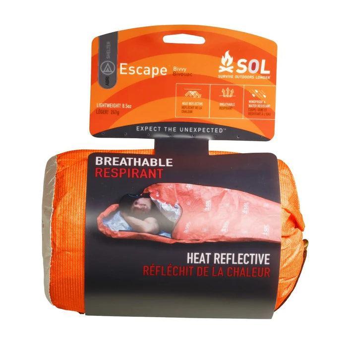 SOL Escape Bivvy orange sleeping bag in retail packaging, labeled breathable and heat reflective