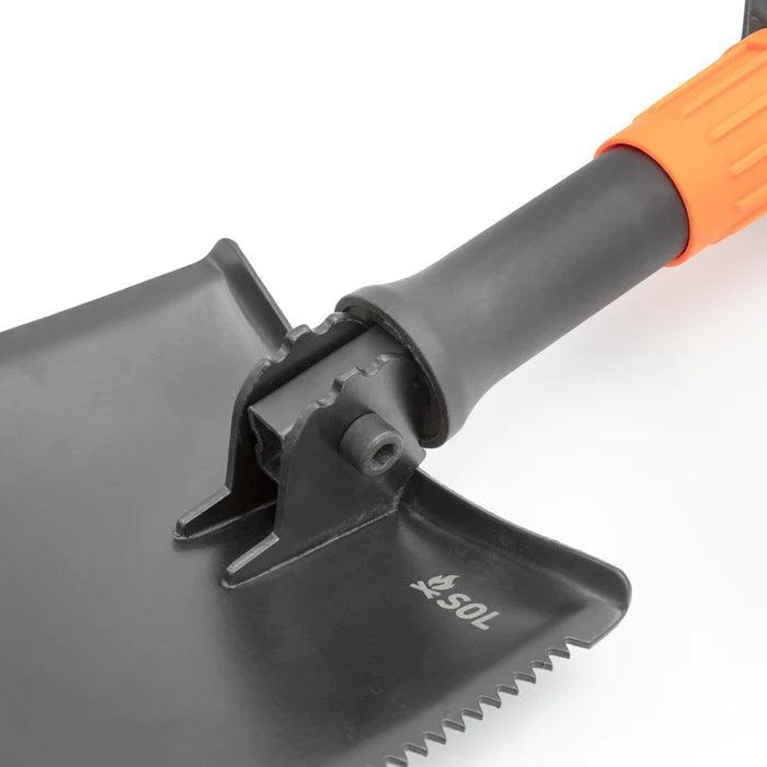 SOL packable field shovel with black blade and orange ergonomic handle on white background