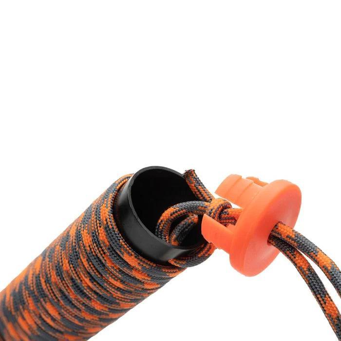 Close-up of orange and black paracord handle with orange cap, outdoor gear accessory