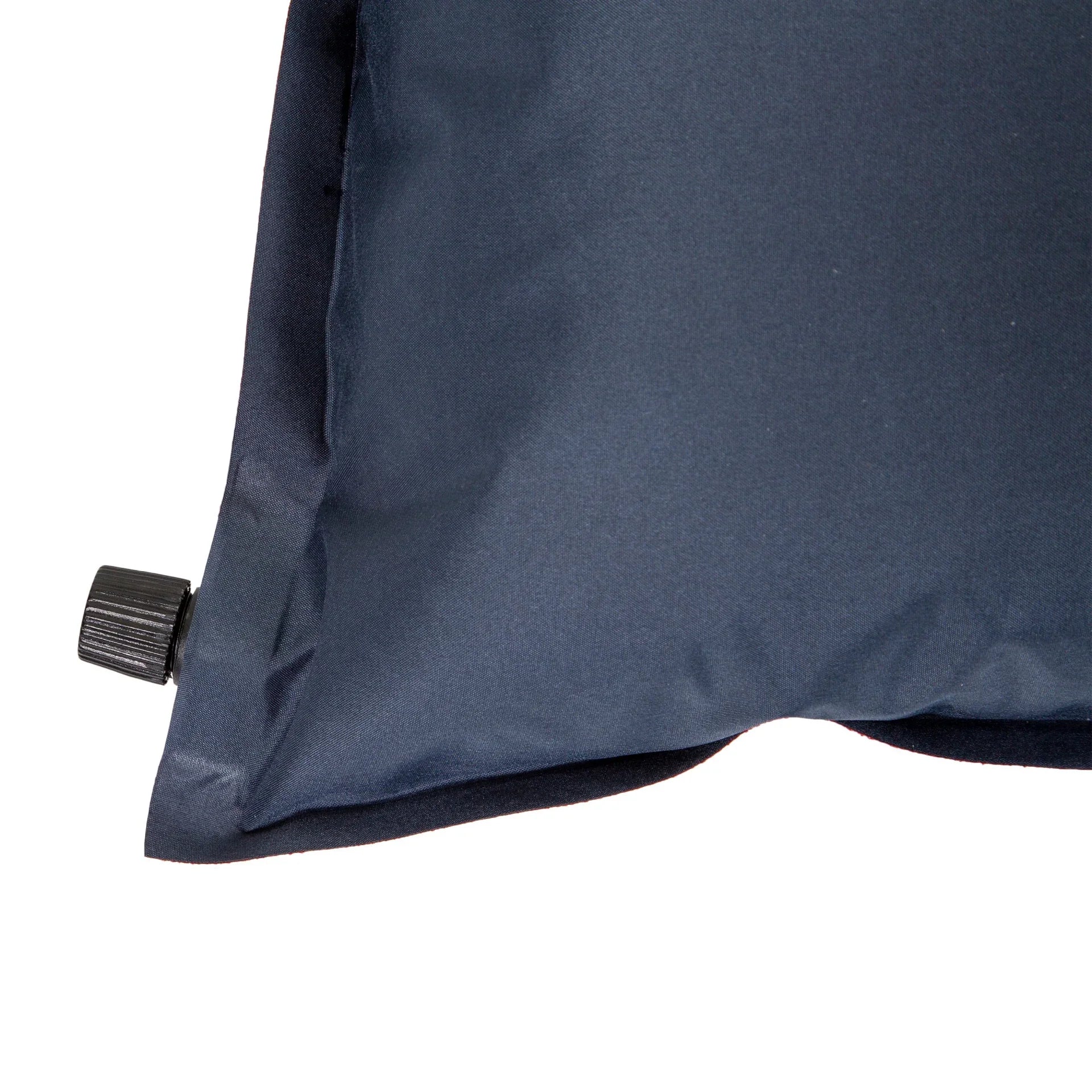 Close-up of navy blue inflatable camping pillow with black air valve
