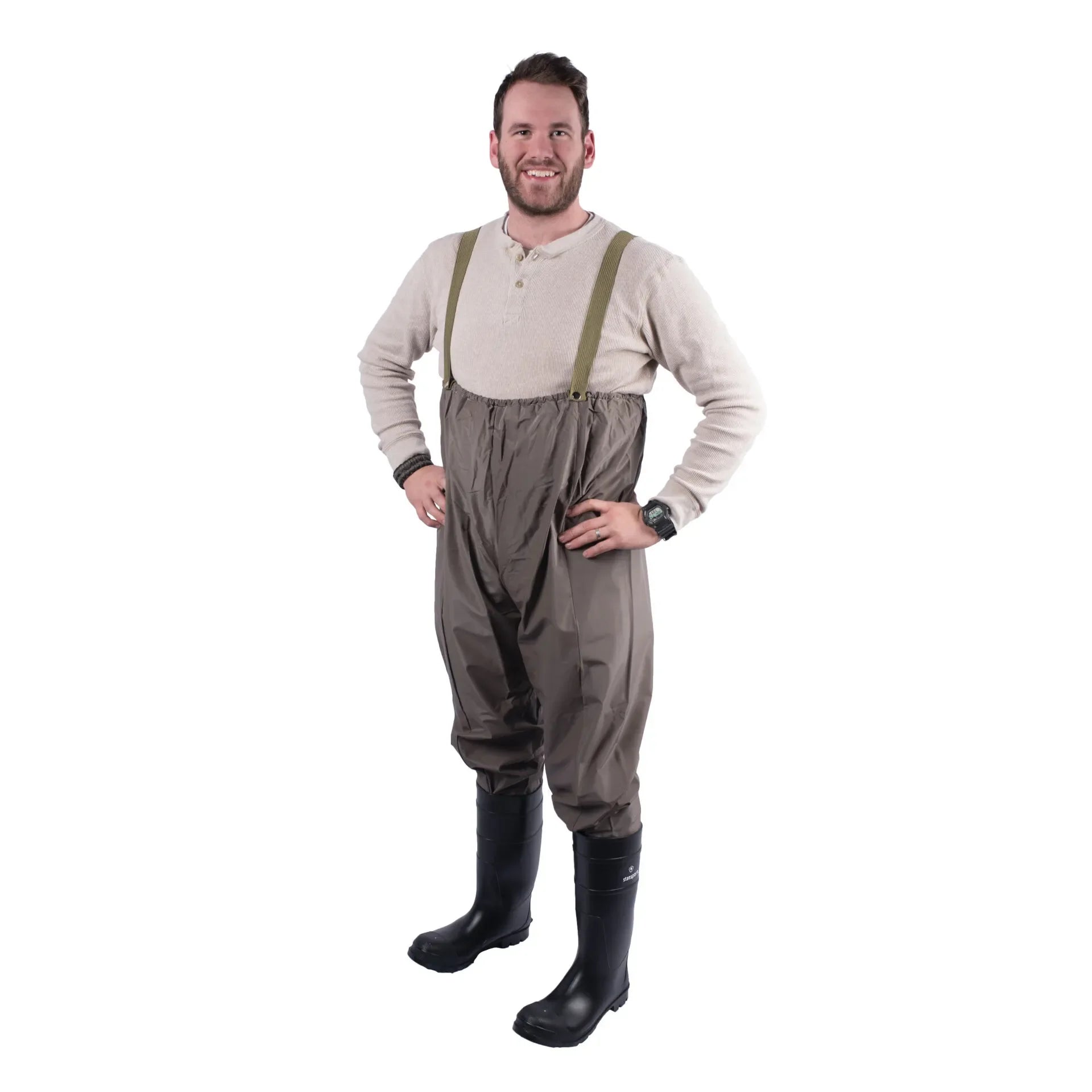 Man wearing chest waders and black rubber boots on white background