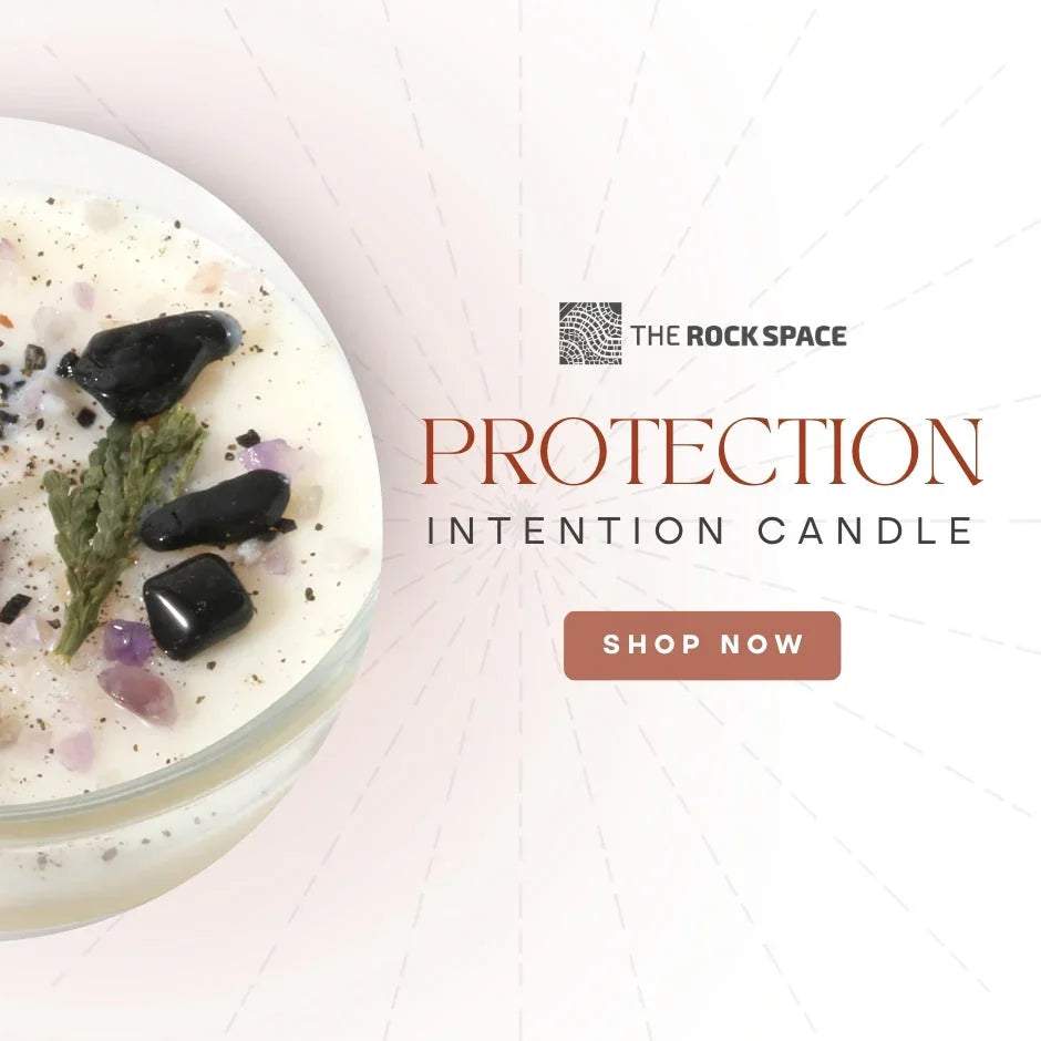 Protection intention candle with crystals and herbs, The Rock Space branding, shop now button