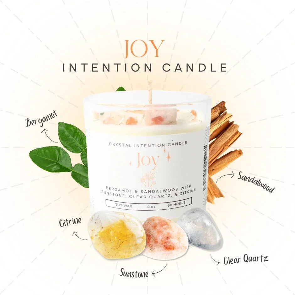 Joy intention candle with bergamot, sandalwood, sunstone, citrine, and clear quartz crystals.