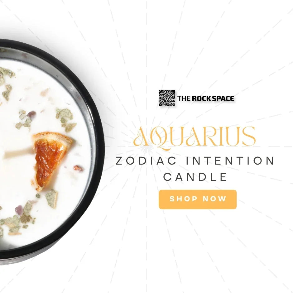 Aquarius zodiac intention candle with herbs and dried orange, The Rock Space branding.