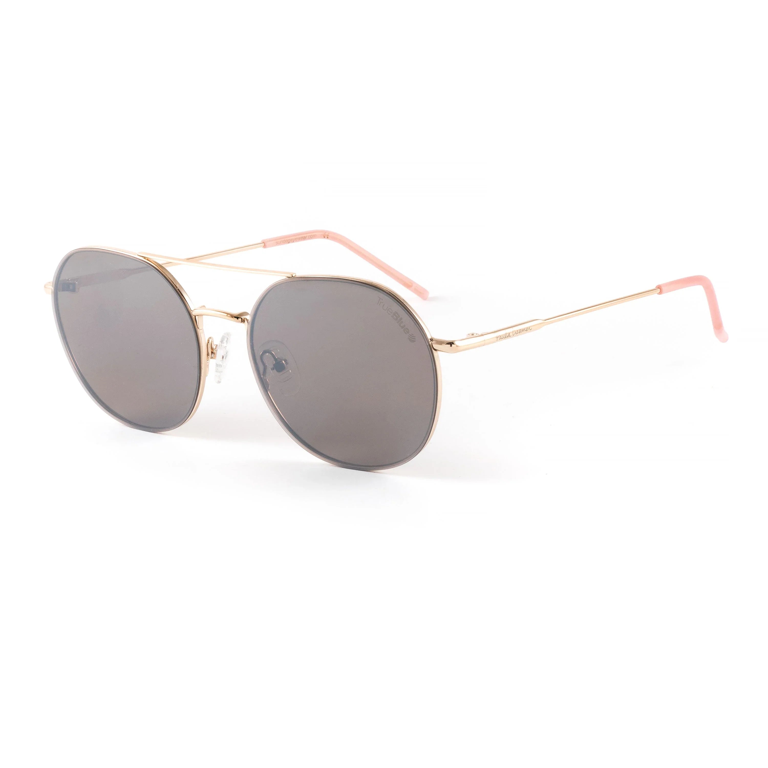 Gold frame round sunglasses with dark lenses and pink temple tips on white background
