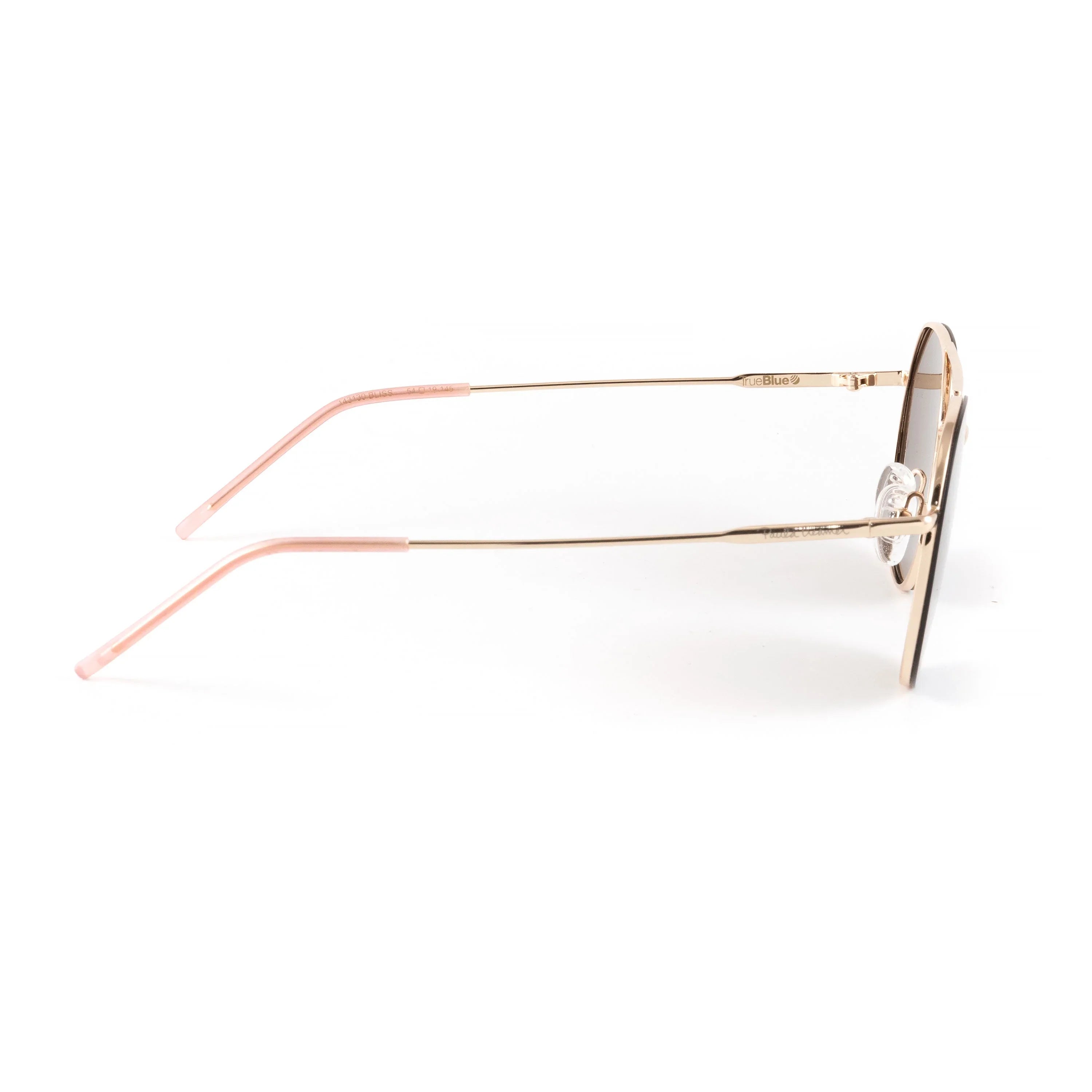 Side view of round gold sunglasses with pink temple tips on white background