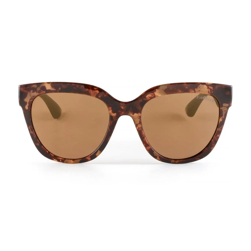 Tortoise shell cat-eye sunglasses with brown lenses on a white background