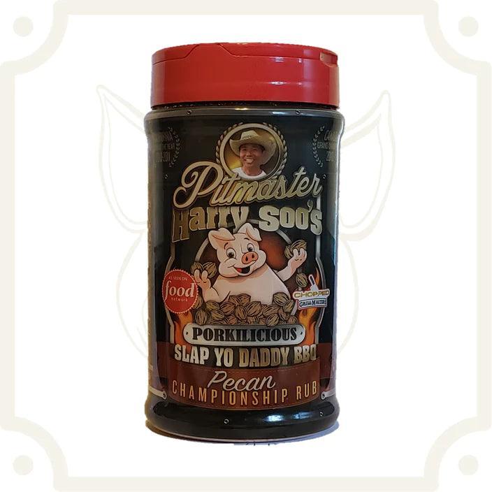 Pitmaster Harry Soo's Porkilicious Pecan BBQ rub bottle with red lid and cartoon pig label