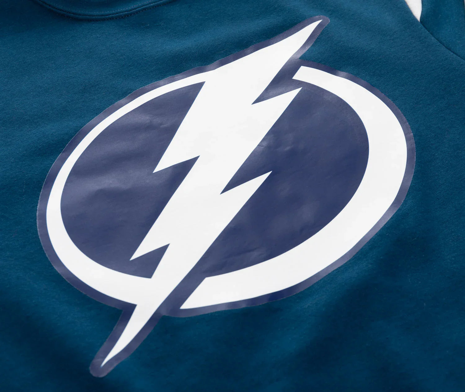 Blue shirt with bold white lightning bolt logo in a navy circle, Tampa sports apparel
