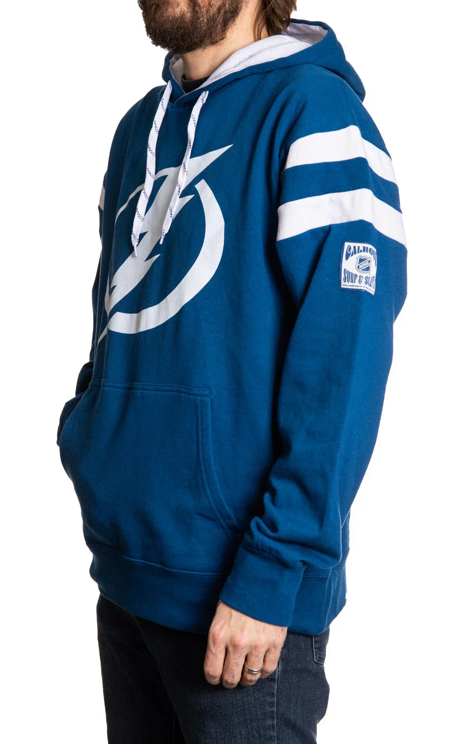 Man wearing blue Tampa Bay Lightning varsity hoodie with white stripes and logo