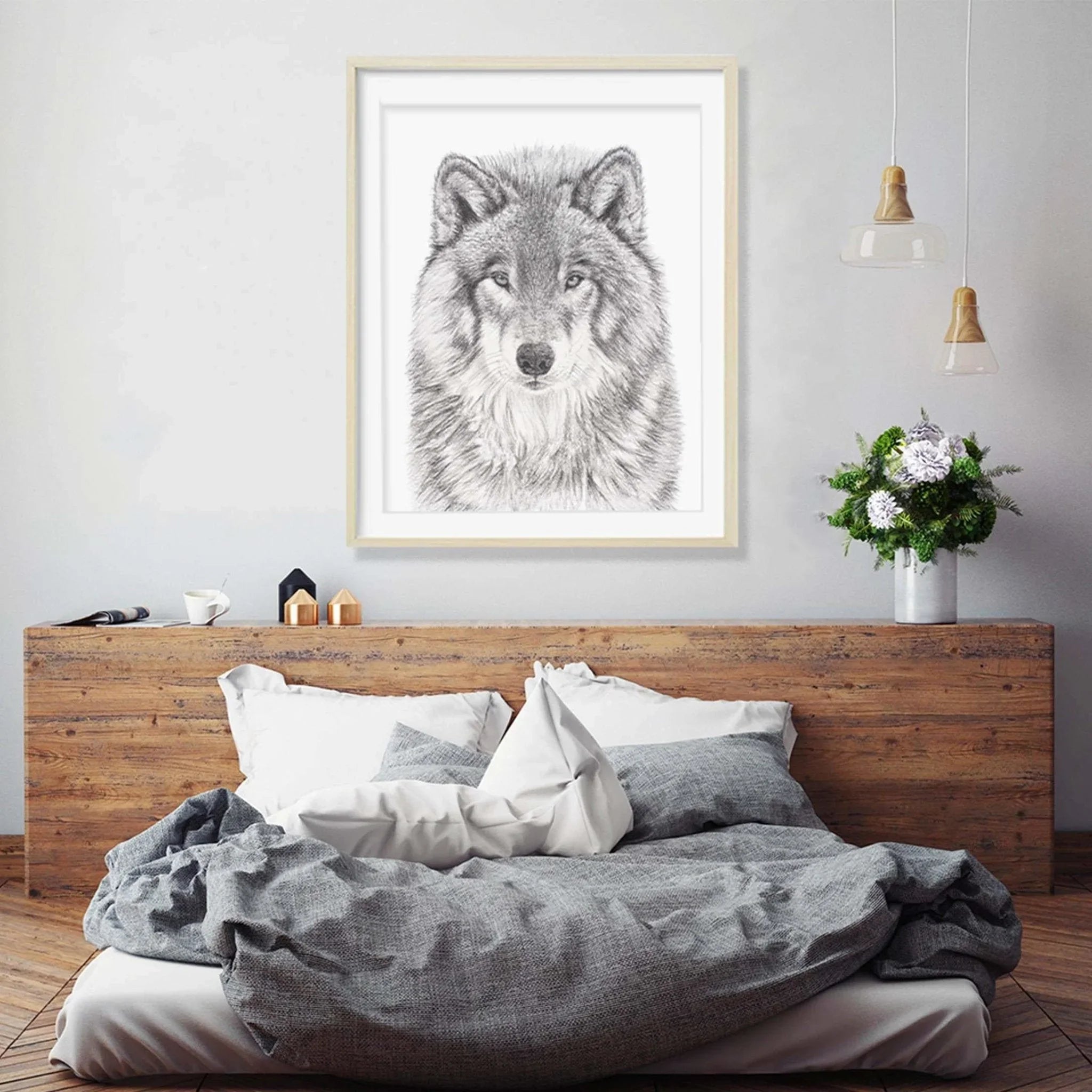 Wolf wall art in modern bedroom with rustic wood bed, gray bedding, and decorative plants