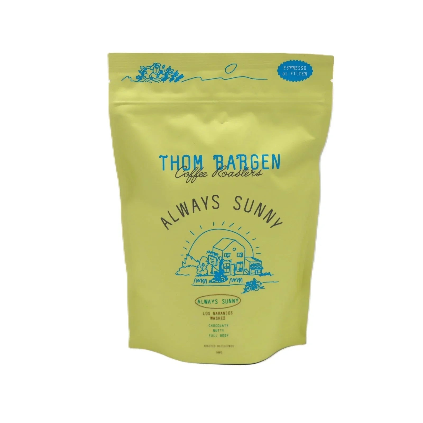 Thom Bargen Always Sunny coffee bag, yellow packaging with blue farm illustration and text.