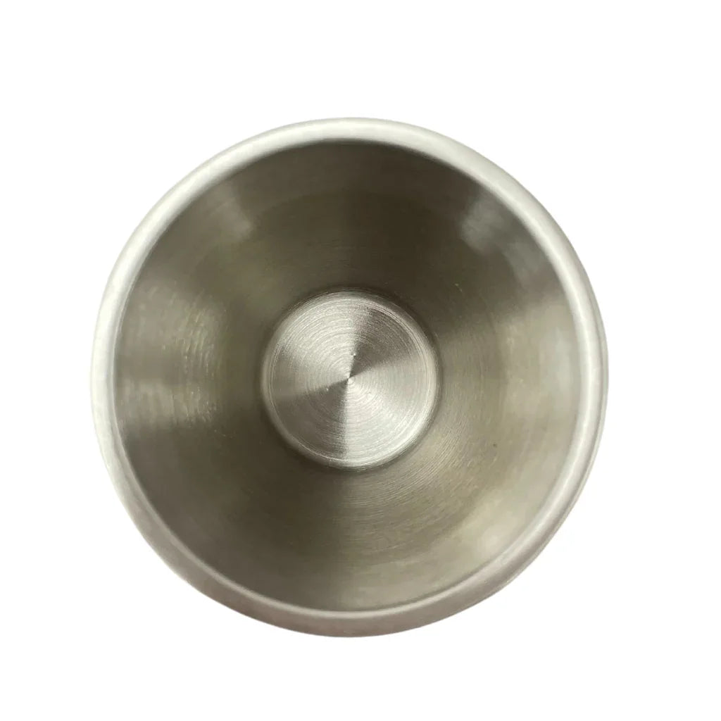 Top view of an empty stainless steel cup, brushed metal surface, white background