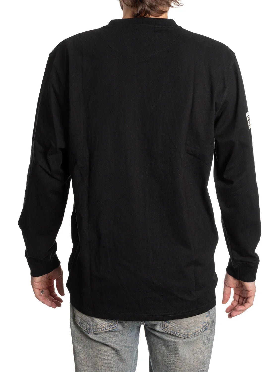 Back view of person wearing black long sleeve henley shirt and light wash jeans
