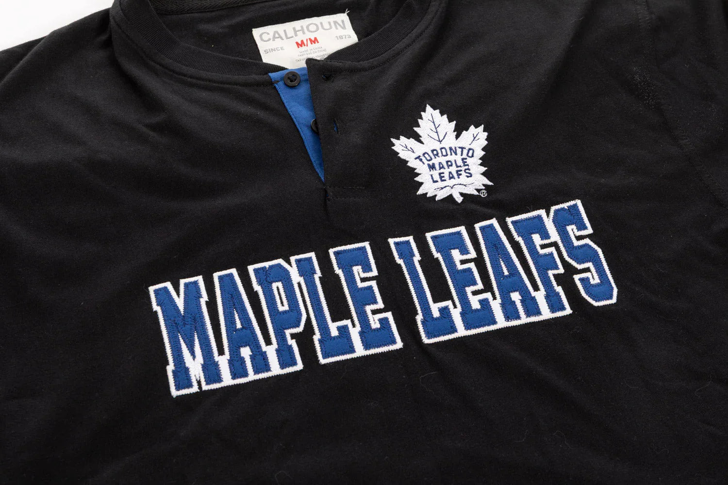 Black Toronto Maple Leafs henley shirt with embroidered team logo and lettering