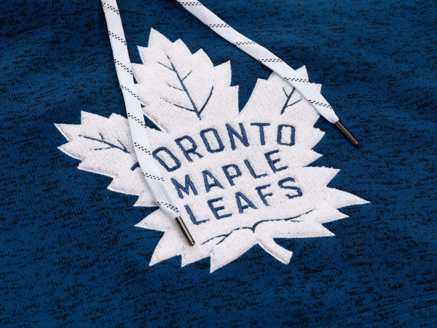 Toronto Maple Leafs logo patch on blue hockey hoodie with white drawstrings