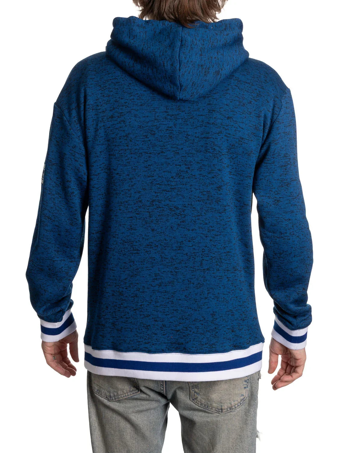 Back view of person wearing navy blue hooded sweatshirt with white striped cuffs and hem