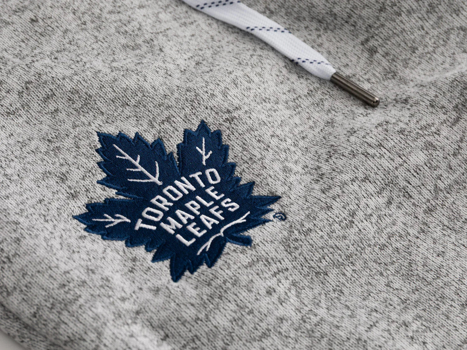 Toronto Maple Leafs logo embroidered on grey sweatpants with white drawstring detail