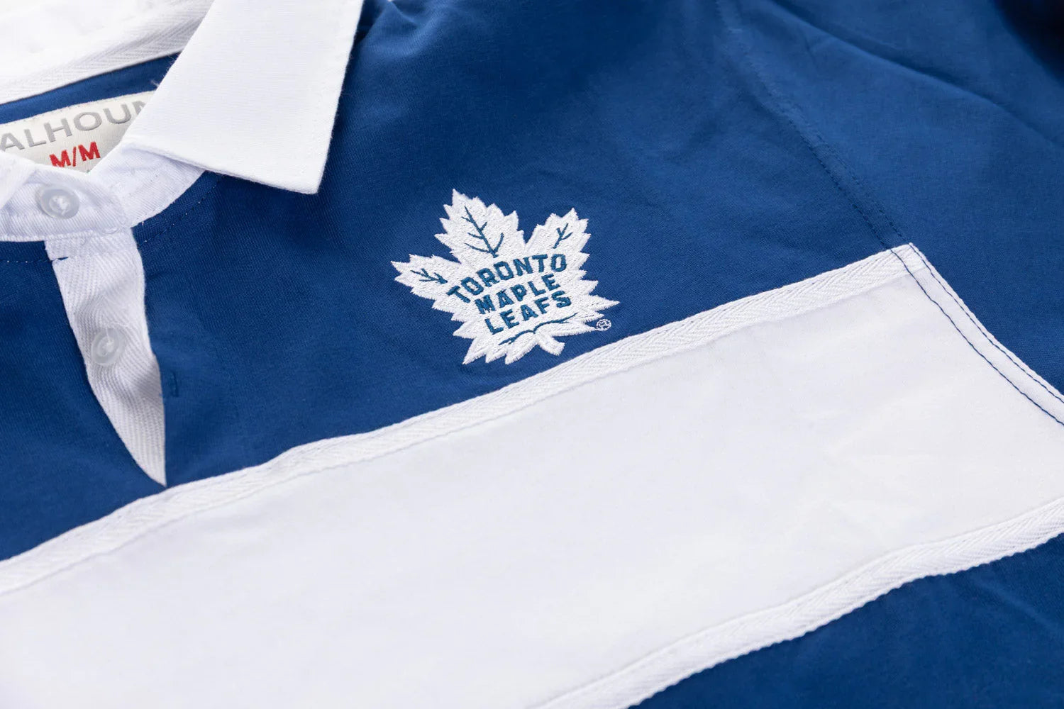 Toronto Maple Leafs rugby shirt with blue and white stripes and embroidered logo detail