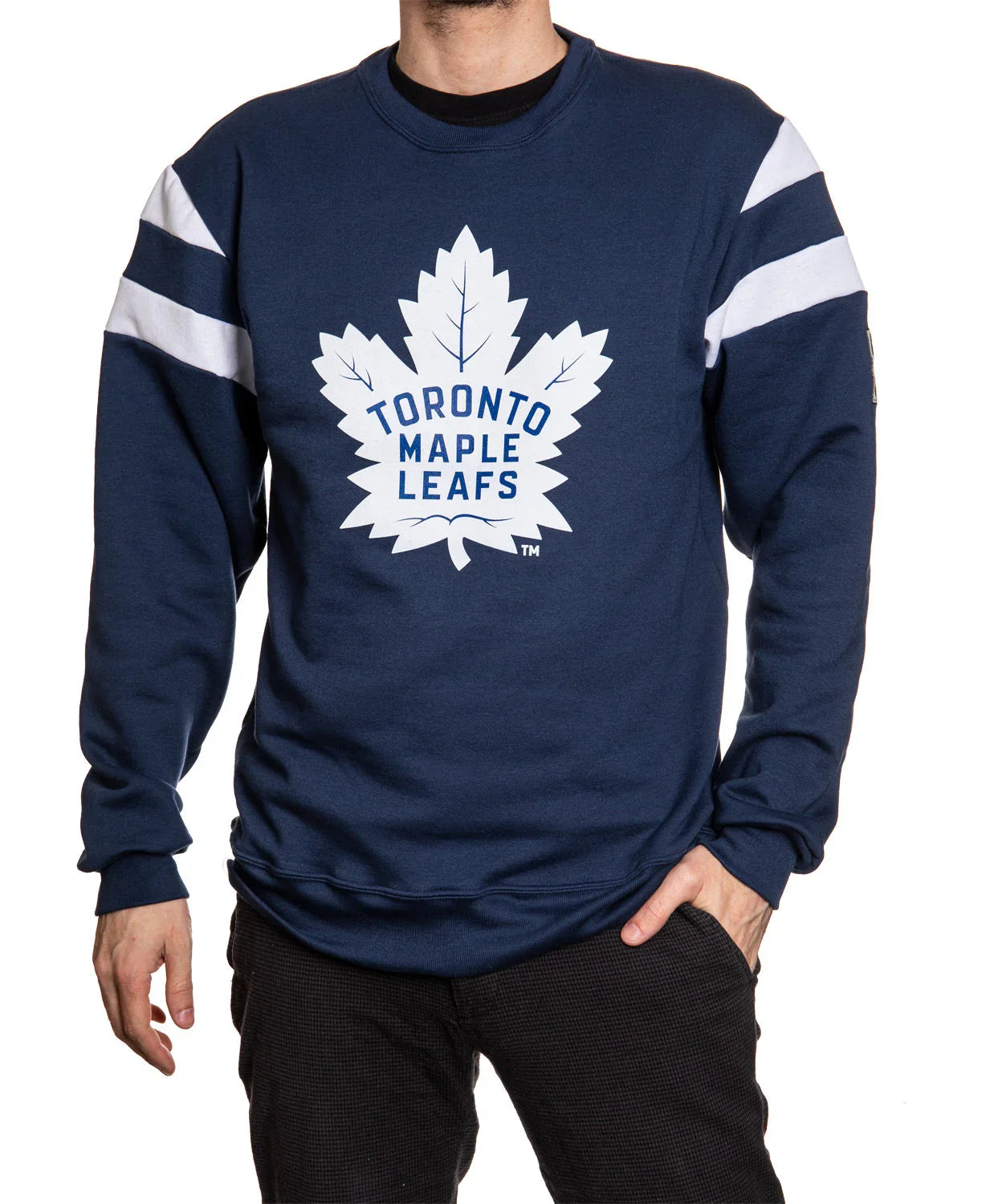 Man wearing navy Toronto Maple Leafs varsity sweater with white stripes and leaf logo