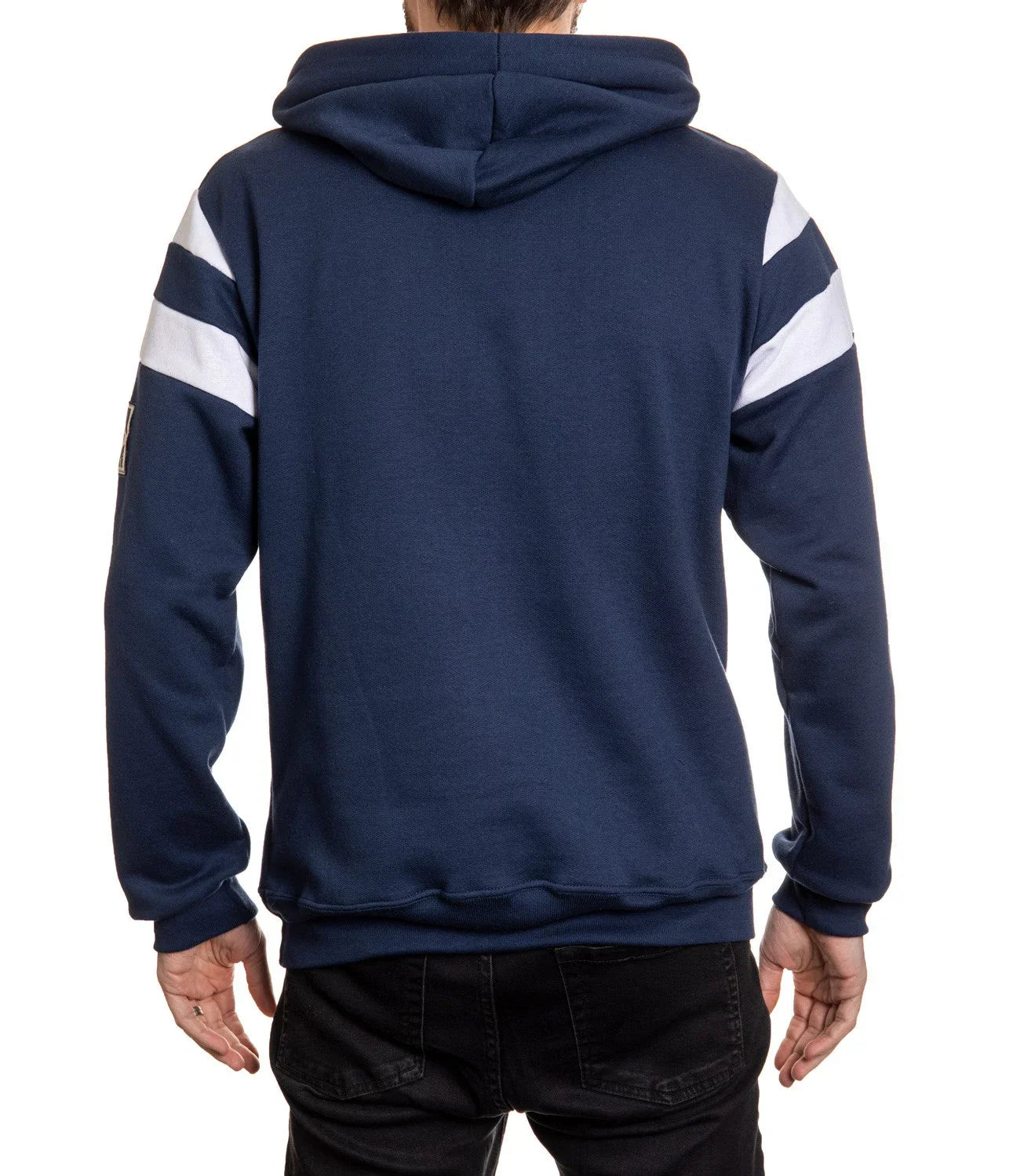 Back view of man wearing navy blue hoodie with white stripes on sleeves