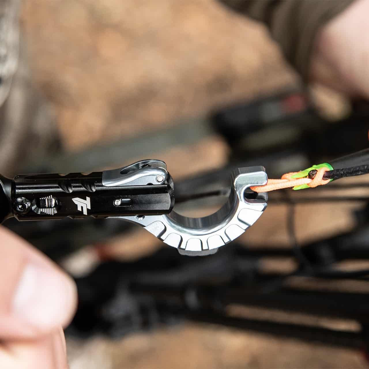 TruFire archery release aid attached to a bowstring outdoors