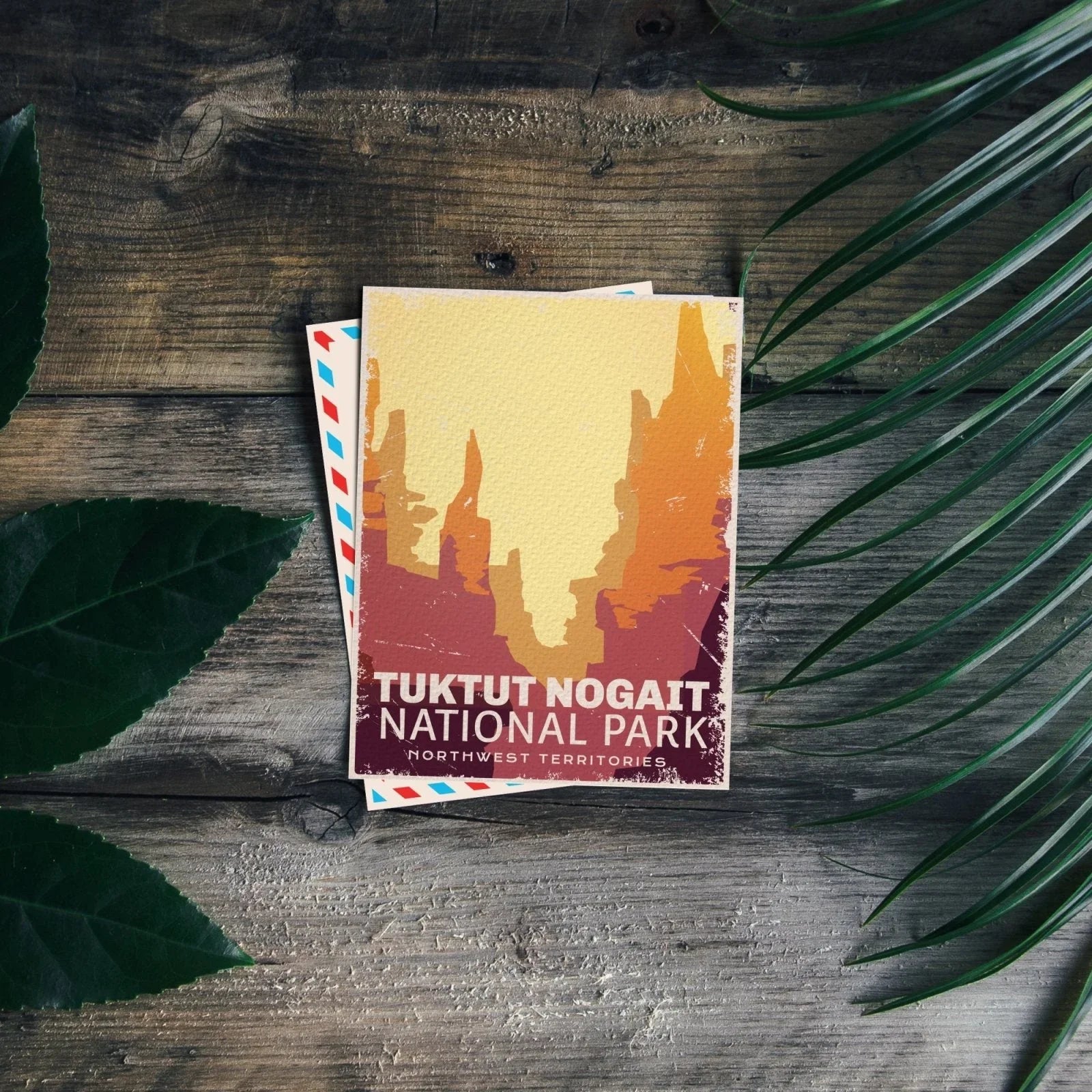 Tuktut Nogait National Park postcard on rustic wood with green leaves, Northwest Territories