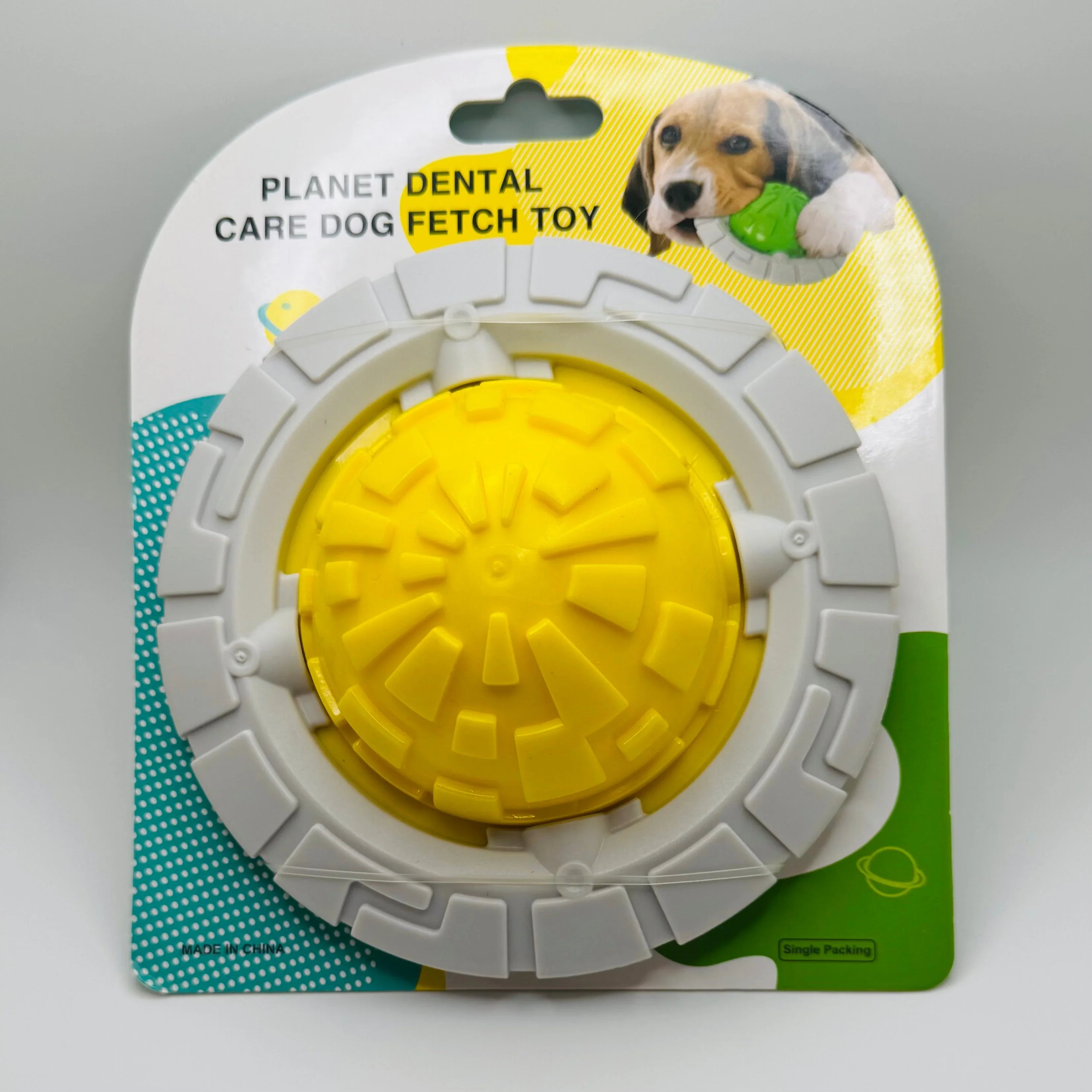 Yellow and gray planet-shaped dental care dog fetch toy in retail packaging