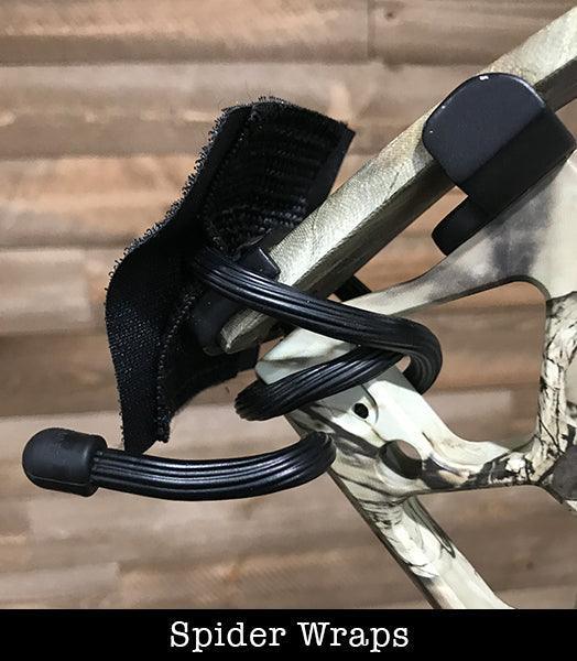 Spider Wraps outdoor weapon attachment with black cords on camo-patterned gear
