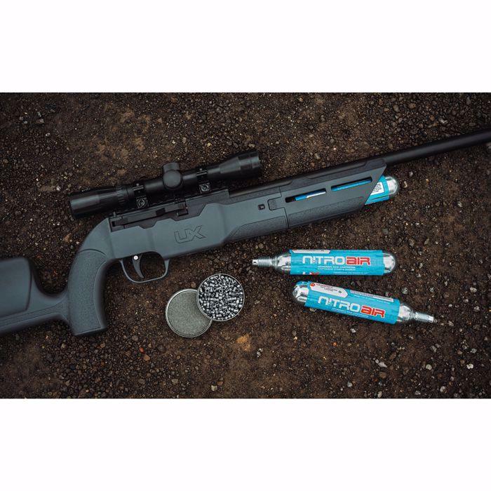 Umarex NitroAir prefilled nitrogen cartridges with air rifle and pellets on gravel